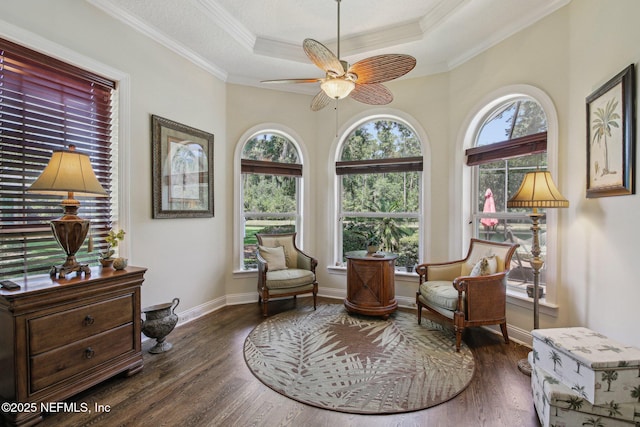 2579 Woodgrove Rd, Fleming Island, FL 32003 - living area featuring a raised ceiling, a ceiling fan, wood finished floors, ornamental molding, and baseboards