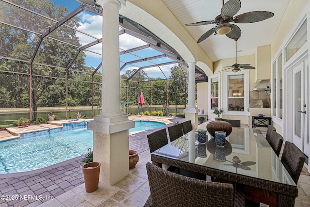 2579 Woodgrove Rd, Fleming Island, FL 32003 - view of patio with a ceiling fan, an outdoor pool, a lanai, and outdoor dining space