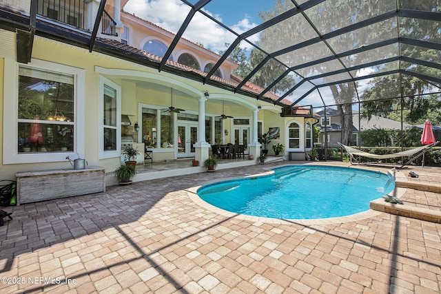2579 Woodgrove Rd, Fleming Island, FL 32003 - swimming pool featuring french doors, a patio area, ceiling fan, and a lanai
