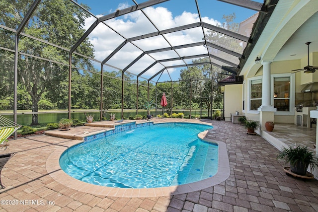 2579 Woodgrove Rd, Fleming Island, FL 32003 - swimming pool featuring a patio, a ceiling fan, and glass enclosure
