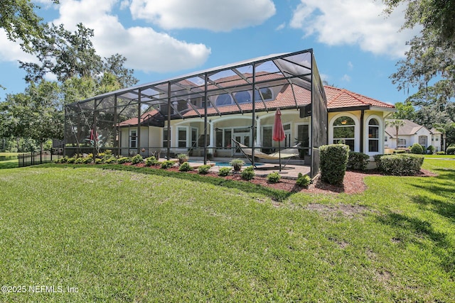 2579 Woodgrove Rd, Fleming Island, FL 32003 - rear view of house with a yard, a patio area, an outdoor pool, and a lanai