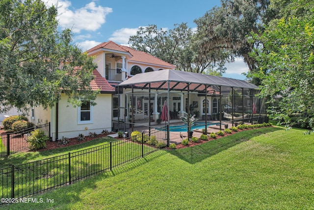 2579 Woodgrove Rd, Fleming Island, FL 32003 - rear view of house with a tile roof, a balcony, stucco siding, ceiling fan, and a patio area