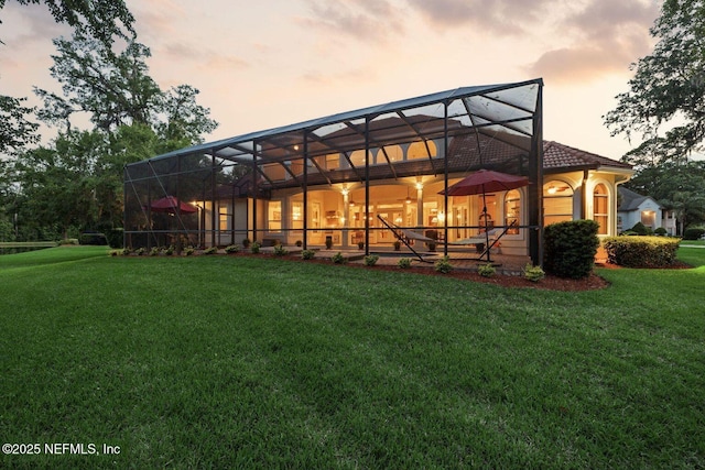 2579 Woodgrove Rd, Fleming Island, FL 32003 - back of house with a lawn and glass enclosure