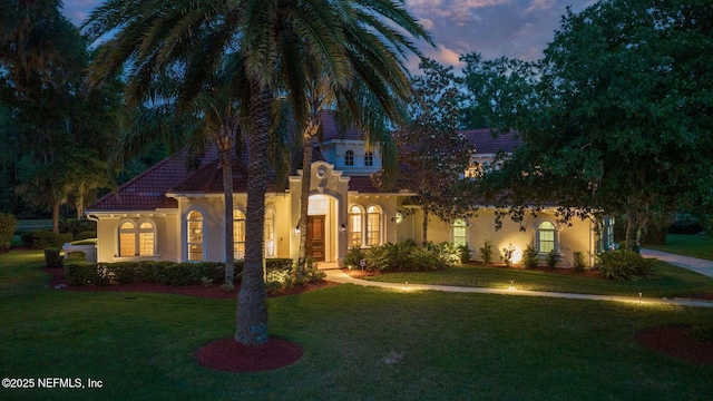 2579 Woodgrove Rd, Fleming Island, FL 32003 - mediterranean / spanish home featuring stucco siding and a front lawn