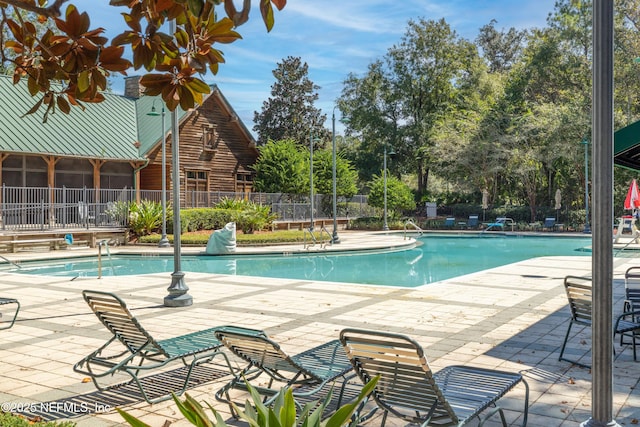 2579 Woodgrove Rd, Fleming Island, FL 32003 - community pool featuring a patio
