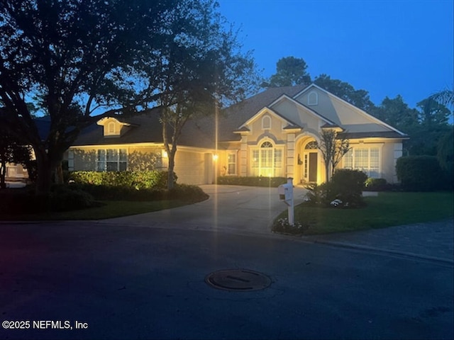 728 Toria Ln, Saint Augustine, FL 32095 - view of front of home with driveway, an attached garage, and a front lawn