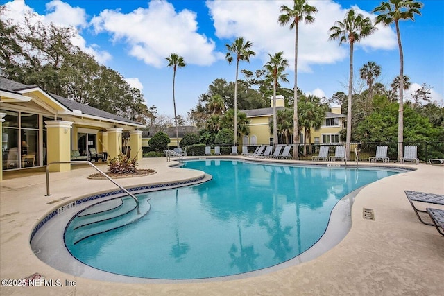 1800 The Greens Way Unit 406, Jacksonville Beach, FL 32250 - community pool with a patio