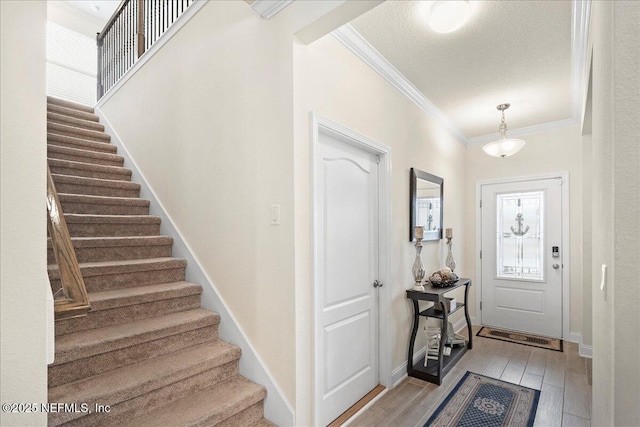 2629 Cold Stream Ln, Green Cove Springs, FL 32043 - foyer entrance featuring ornamental molding, stairs, and light wood-type flooring