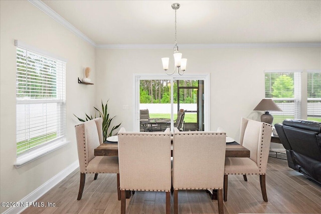 2629 Cold Stream Ln, Green Cove Springs, FL 32043 - dining room with a chandelier, crown molding, and wood finished floors