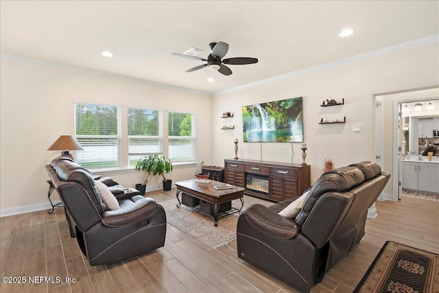 2629 Cold Stream Ln, Green Cove Springs, FL 32043 - living area featuring wood finished floors, ceiling fan, ornamental molding, and recessed lighting