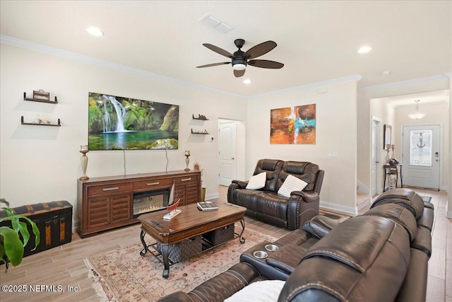 2629 Cold Stream Ln, Green Cove Springs, FL 32043 - living room with light wood-style flooring, ceiling fan, crown molding, and recessed lighting