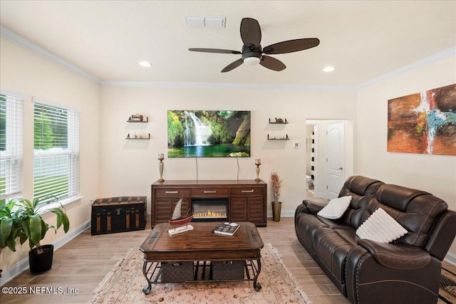 2629 Cold Stream Ln, Green Cove Springs, FL 32043 - living room with light wood-style floors, ceiling fan, crown molding, and recessed lighting
