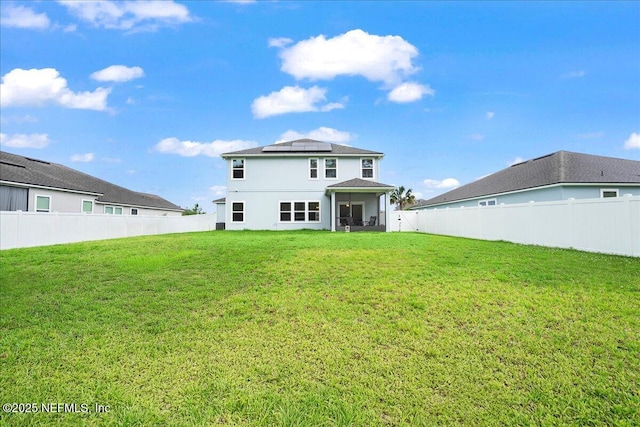 2629 Cold Stream Ln, Green Cove Springs, FL 32043 - back of property featuring solar panels, a fenced backyard, and stucco siding