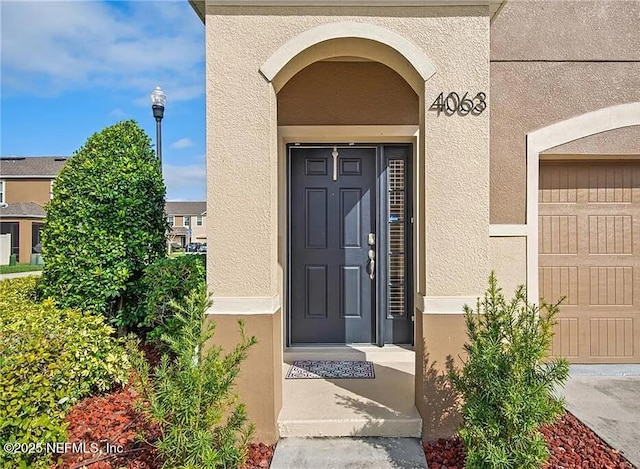 4063 70th Ter N, Pinellas Park, FL 33781 - entrance to property featuring stucco siding