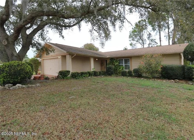 4431 Mitcher Rd, New Port Richey, FL 34653 - ranch-style home featuring a garage, a front yard, and stucco siding