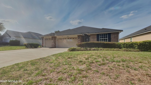 4053 Trail Ridge Rd, Middleburg, FL 32068 - ranch-style home with a garage, driveway, a front yard, and brick siding