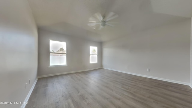4053 Trail Ridge Rd, Middleburg, FL 32068 - empty room featuring a ceiling fan, wood finished floors, baseboards, and lofted ceiling