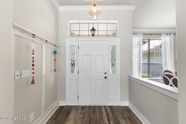 1759 Rising Oaks Dr, Jacksonville, FL 32223 - entrance foyer with crown molding, baseboards, and dark wood-style flooring