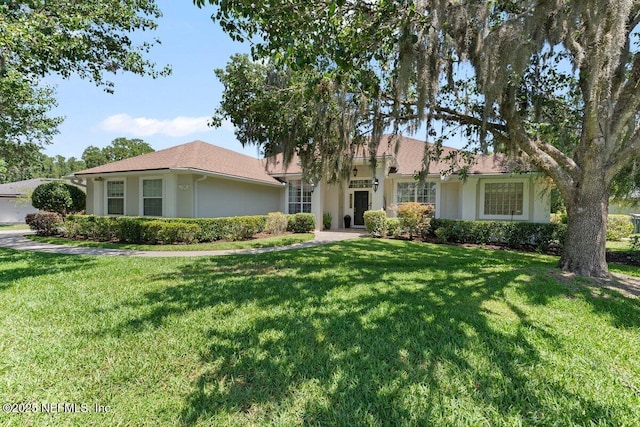 1759 Rising Oaks Dr, Jacksonville, FL 32223 - single story home featuring a front yard and stucco siding