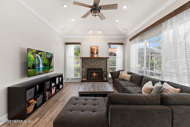 1759 Rising Oaks Dr, Jacksonville, FL 32223 - living area featuring lofted ceiling, light wood finished floors, a ceiling fan, recessed lighting, and ornamental molding