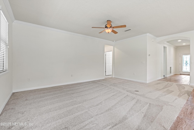 109 Sweet Pine Trl, Ponte Vedra, FL 32081 - empty room with arched walkways, ornamental molding, light colored carpet, ceiling fan, and baseboards