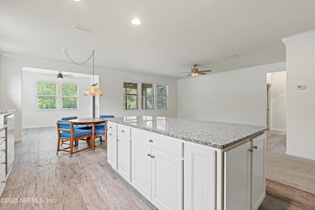 109 Sweet Pine Trl, Ponte Vedra, FL 32081 - kitchen with a ceiling fan, baseboards, a center island, recessed lighting, and ornamental molding