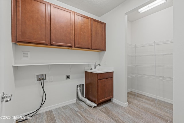 109 Sweet Pine Trl, Ponte Vedra, FL 32081 - laundry room featuring cabinet space, hookup for an electric dryer, washer hookup, and baseboards