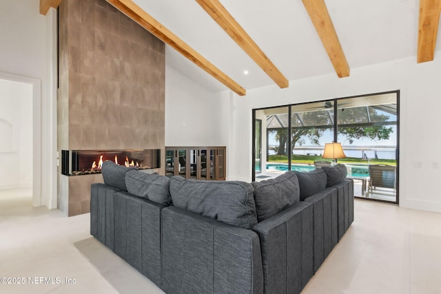 95544 Wilder Blvd, Fernandina Beach, FL 32034 - living area featuring beam ceiling, a large fireplace, and high vaulted ceiling