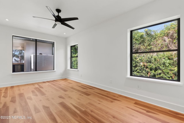 95544 Wilder Blvd, Fernandina Beach, FL 32034 - unfurnished room with plenty of natural light, baseboards, wood finished floors, a ceiling fan, and recessed lighting