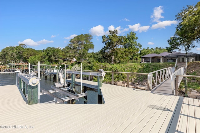 95544 Wilder Blvd, Fernandina Beach, FL 32034 - dock featuring boat lift, a water view, and view of scattered trees