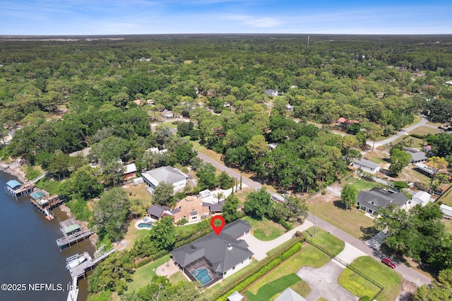 95544 Wilder Blvd, Fernandina Beach, FL 32034 - aerial view of property and surrounding area with a heavily wooded area, a large body of water, and nearby suburban area
