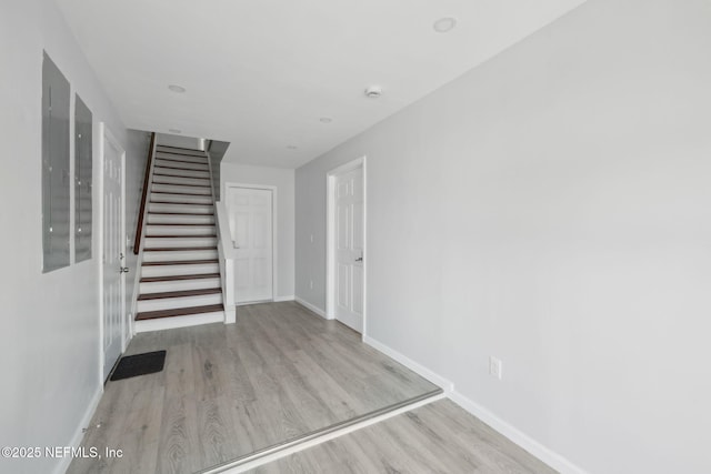 2010 N Main St, Jacksonville, FL 32206 - entrance foyer with wood finished floors, stairway, baseboards, and electric panel