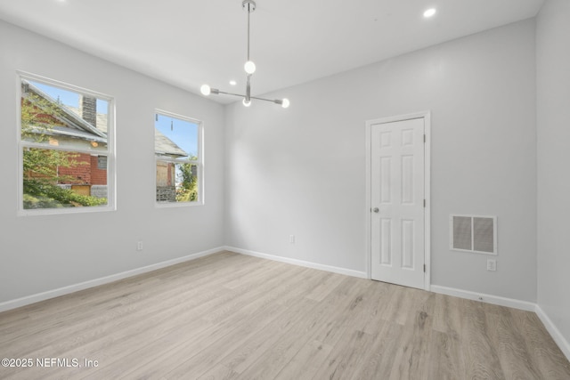 2010 N Main St, Jacksonville, FL 32206 - unfurnished room with light wood-style floors, a chandelier, baseboards, and recessed lighting
