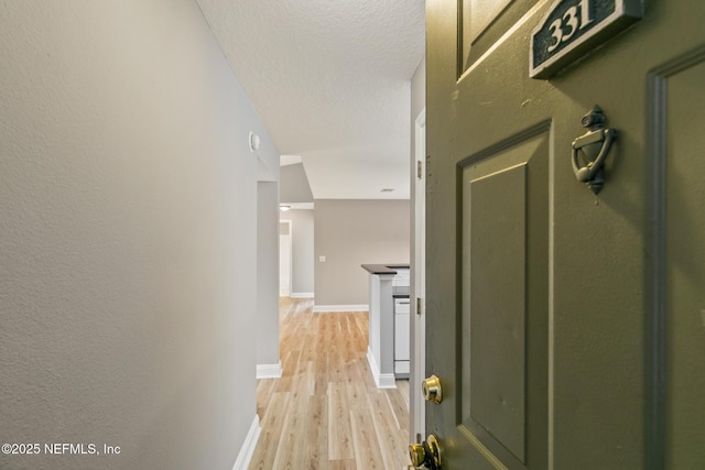 7701 Timberlin Park Blvd Unit 331, Jacksonville, FL 32256 - hall with light wood-style floors and baseboards