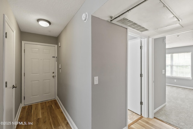 7701 Timberlin Park Blvd Unit 331, Jacksonville, FL 32256 - hall featuring baseboards and wood finished floors