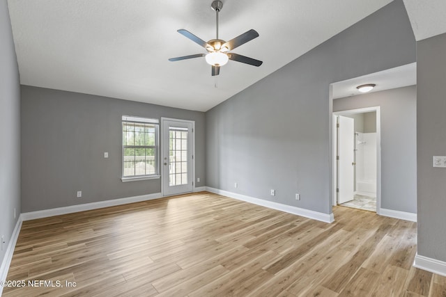 7701 Timberlin Park Blvd Unit 331, Jacksonville, FL 32256 - spare room featuring vaulted ceiling, ceiling fan, light wood-style floors, and baseboards