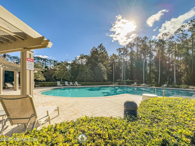 7701 Timberlin Park Blvd Unit 331, Jacksonville, FL 32256 - community pool with a patio and view of scattered trees