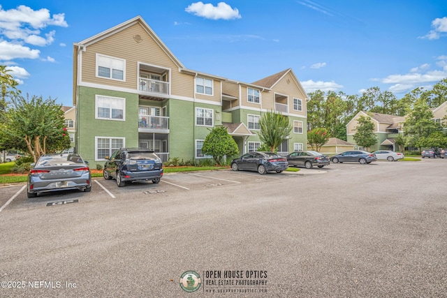 7701 Timberlin Park Blvd Unit 331, Jacksonville, FL 32256 - view of building exterior with uncovered parking