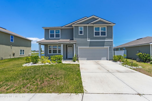 3238 Little Fawn Ln, Green Cove Springs, FL 32137 - view of front of property featuring a garage, a front lawn, driveway, and covered porch