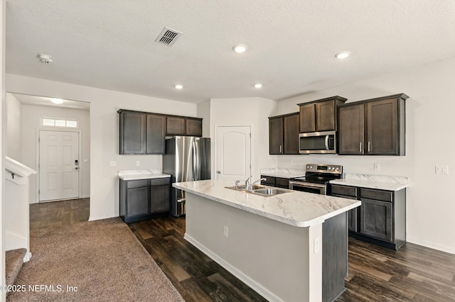 3238 Little Fawn Ln, Green Cove Springs, FL 32137 - kitchen with appliances with stainless steel finishes, a sink, dark wood-style flooring, recessed lighting, and a textured ceiling