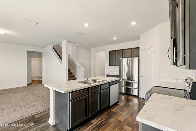 3238 Little Fawn Ln, Green Cove Springs, FL 32137 - kitchen featuring appliances with stainless steel finishes, a sink, an island with sink, dark wood finished floors, and open floor plan