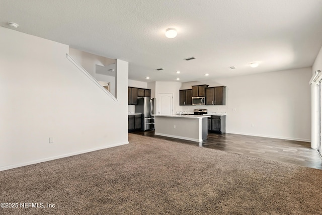 3238 Little Fawn Ln, Green Cove Springs, FL 32137 - unfurnished living room featuring dark colored carpet, baseboards, recessed lighting, and a textured ceiling