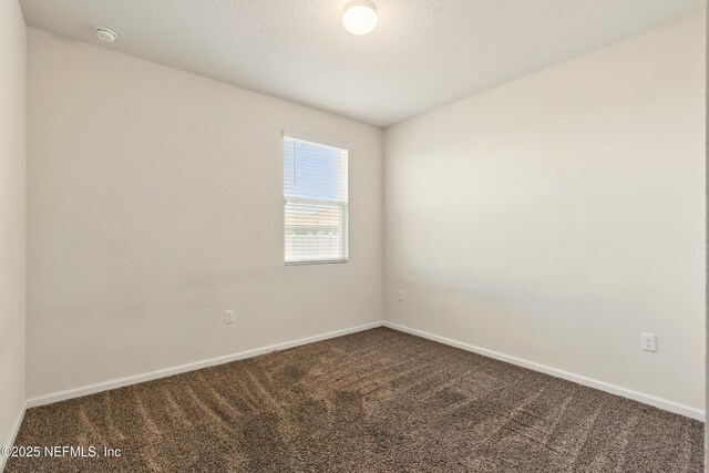3238 Little Fawn Ln, Green Cove Springs, FL 32137 - spare room with dark carpet, a smoke detector, and baseboards