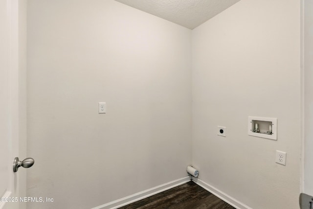 3238 Little Fawn Ln, Green Cove Springs, FL 32137 - laundry area with electric dryer hookup, hookup for a washing machine, dark wood-type flooring, baseboards, and a textured ceiling