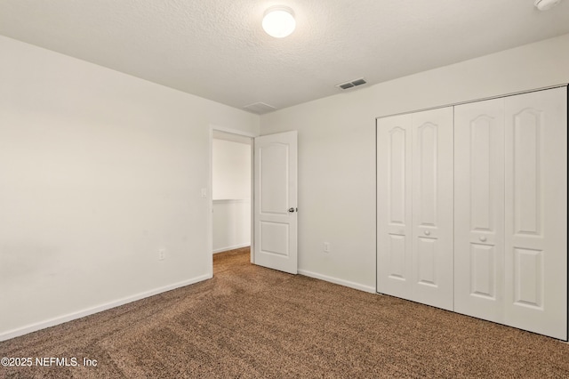 3238 Little Fawn Ln, Green Cove Springs, FL 32137 - unfurnished bedroom with carpet flooring, a closet, baseboards, and a textured ceiling