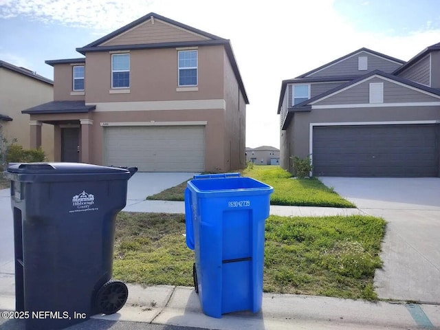3180 Oyster Cover St, Wimauma, FL 33598 - traditional home with concrete driveway and stucco siding