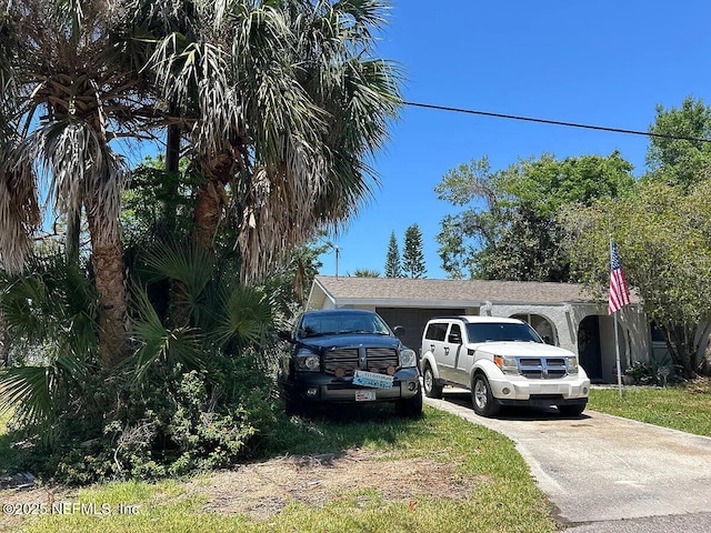 8523 Lafitte Dr, Hudson, FL 34667 - view of home's exterior featuring concrete driveway
