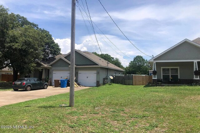 7602 Blackjack Cir, Navarre, FL 32566 - view of property exterior featuring concrete driveway and a garage