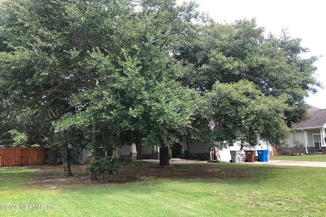 7602 Blackjack Cir, Navarre, FL 32566 - view of front facade featuring concrete driveway and a garage