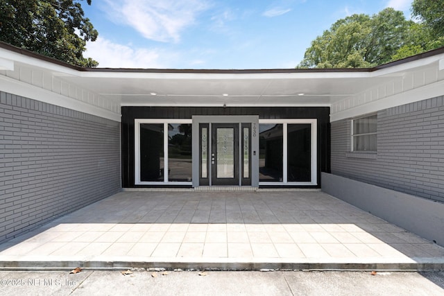 7930 Bellemeade Blvd, Jacksonville, FL 32211 - property entrance featuring a patio and brick siding